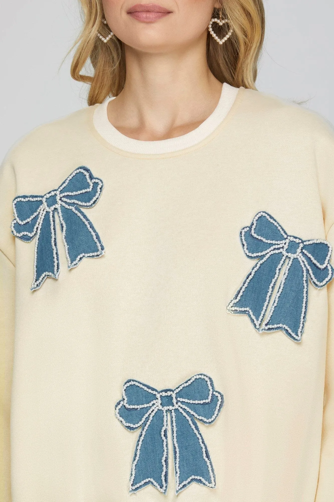 DENIM PEARL BOW PATCH LONG SLEEVE SWEATSHIRT