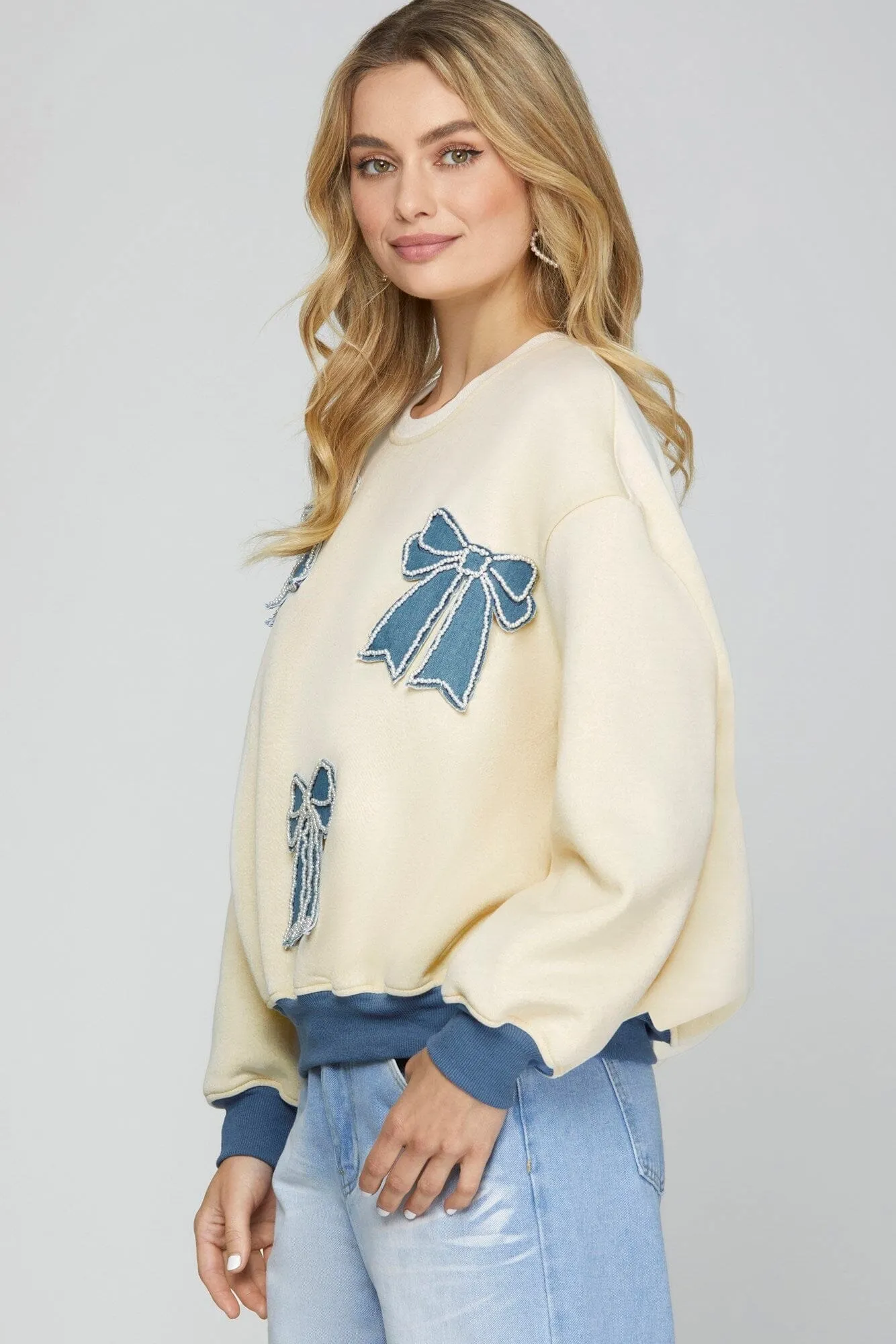 DENIM PEARL BOW PATCH LONG SLEEVE SWEATSHIRT